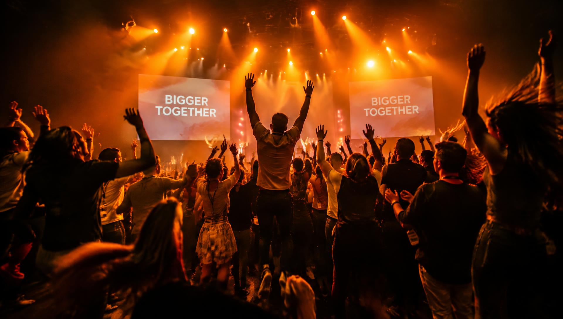Audience celebrating at a Do Your Why event